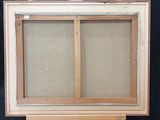 an old painting is sitting on a easel in front of a black wall
