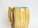 a wooden mug with a handle on a white background