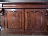 a wooden cabinet that has two doors on it