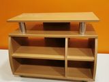 a wooden shelf with two shelves on top of it