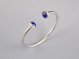 a white gold ring with lapis and diamonds