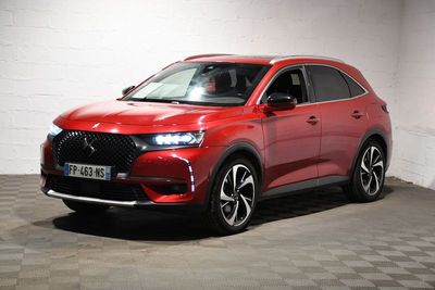 the red dsx is parked in a white room