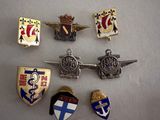 a lot of badges that are on a table