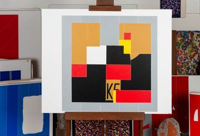 a picture of a painting on a easel in a room