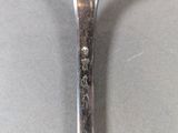 a spoon that is sitting on a table with a spoon in it