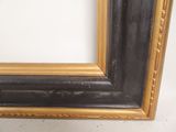 a picture of a picture of a black and gold frame