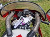 a close up view of a motorcycle ' s dashboard and handlebars