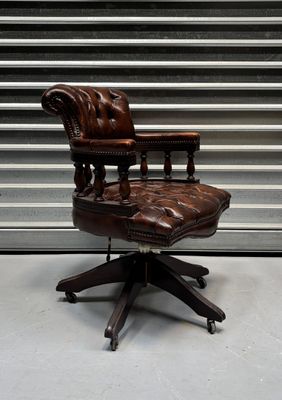 an image of a brown leather office chair with a foot rest