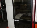 an image of a refrigerator in a kitchen with a glass door