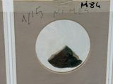 a picture of a picture of a mountain in a glass case