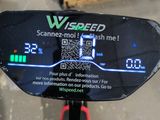 a close up of a bike with a gps screen on it