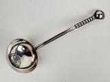an image of a spoon with a metal handle on a white surface