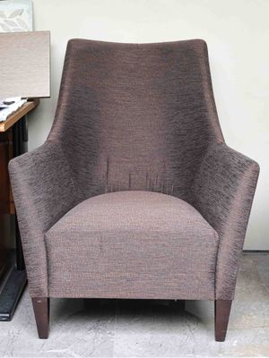 a chair that is sitting next to a lamp