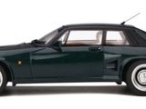 the car is green and has white rims on the tires
