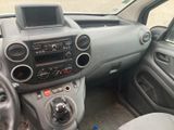 a dashboard of a car with a radio and a steering wheel