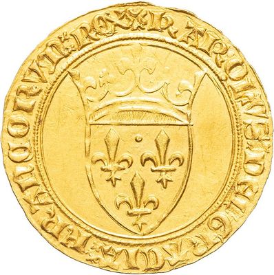 a close up of a gold coin with a crown on it