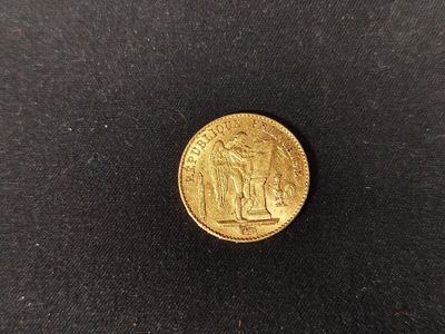 a gold coin with an image of a man and a woman on it