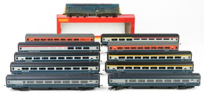 a lot of toy trains that are sitting on top of each other