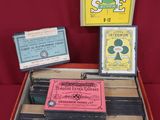 a wooden box filled with different items on a red surface
