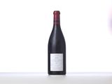 a bottle of wine that is sitting on a table
