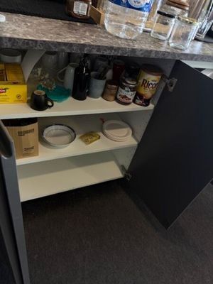 an image of a kitchen cupboard with a lot of food on it