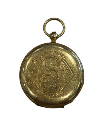 an image of a gold pocket watch with a picture of a woman on it