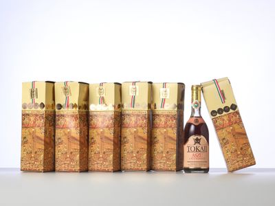 a close up of a bottle of liquor next to a row of lighters