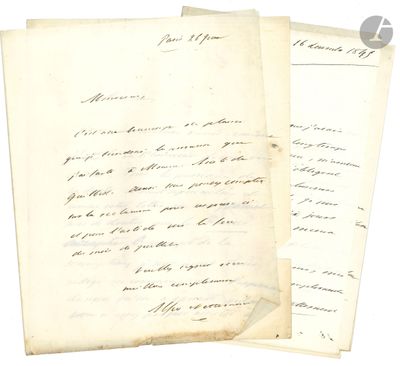 two old papers with writing on them sitting next to each other