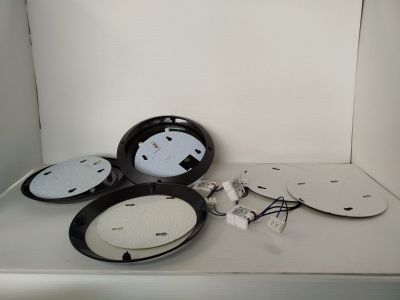 three clocks that are sitting on a shelf in a room