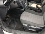 the interior of a car with a steering wheel and a steering control