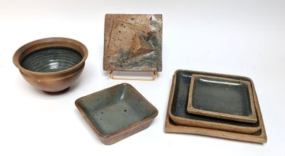 three bowls and a plate on the table