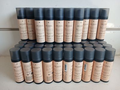 many bottles of makeup sitting on a shelf