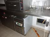 an image of a commercial kitchen with a lot of counter space