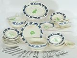 a lot of dishes and spoons that are on the table