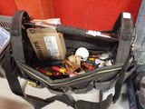 a bag with tools in it sitting on a table