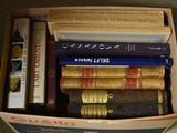 a box full of books sitting on the floor