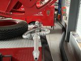an image of a red fire truck in a garage