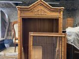 a wooden cabinet with a mesh door in the middle of it