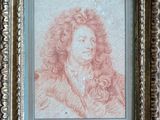 un tableau représentant un homme aux cheveux bouclés, dans un cadre doré