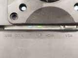 a close up of a metal device with a button on it