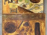 two paintings on a wall of a kitchen with a table and a chair