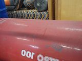 a red boat that is sitting in a room