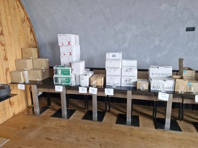 many boxes and boxes on a table in a room