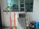 a ladder leaning against a wall in a garage