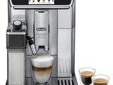 a close up of a coffee machine with two cups of coffee