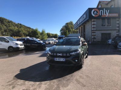 a car parked in front of a building in a parking lot