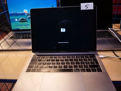 two laptops that are sitting on a desk