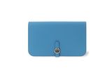 a blue leather wallet with a metal clasp on the front