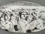 a black and white photo of a group of people on a plate