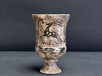 a vase that has a picture of a woman on it